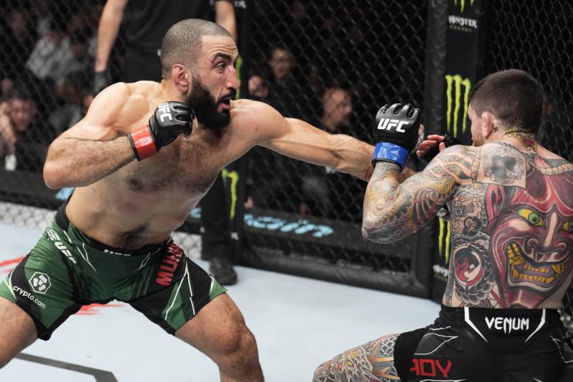 Belal Muhammad punches Sean Brady in a welterweight fight during the UFC 280 event at Etihad Arena