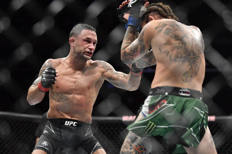 Frankie Edgar punches Marlon Vera of Ecuador in their bantamweight fight during the UFC 268 event at Madison Square Garden