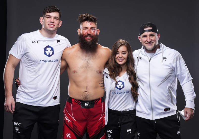 Bryan Barberena and his team pose for a portrait after his victory during the UFC 276 event