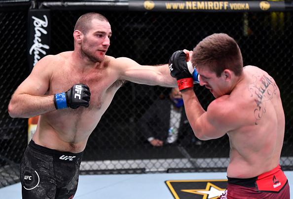 Sean Strickland punches Brendan Allen in a 195-pound catchweight fight during the UFC Fight Night event at UFC APEX on November 14, 2020 in Las Vegas, Nevada. (Photo by Jeff Bottari/Zuffa LLC)