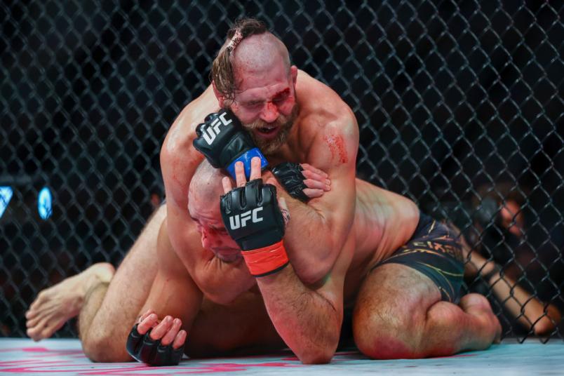 Jiri Prochazka of Czech Republic submits Glover Teixeira of Brazil in the UFC light heavyweight championship fight at Singapore Indoor Stadium on June 12, 2022 in Singapore. (Photo by Yong Teck Lim/Getty Images)