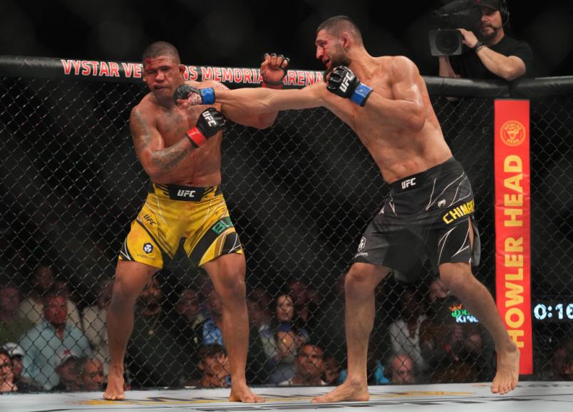 Khamzat Chimaev of Russia punches Gilbert Burns of Brazil in their welterweight fight during the UFC 273 event at VyStar Veterans Memorial Arena on April 09, 2022 in Jacksonville, Florida. (Photo by Cooper Neill/Zuffa LLC)