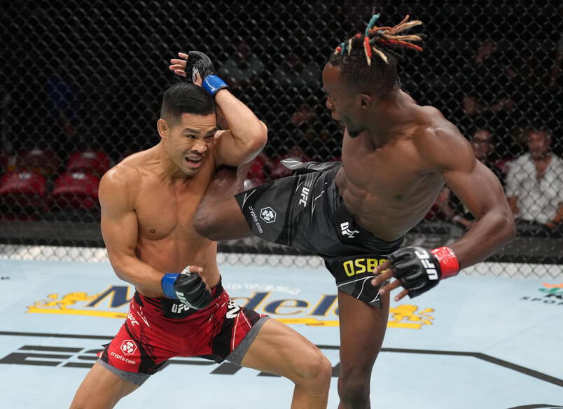 Ode Osbourne of Jamaica kicks Tyson Nam in a flyweight fight during the UFC Fight Night event at Pechanga Arena on August 13, 2022 in San Diego, California. (Photo by Jeff Bottari/Zuffa LLC)