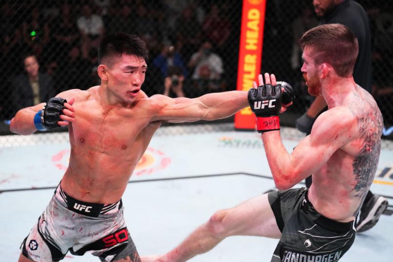Yadong Song of China punches Cory Sandhagen in a bantamweight fight during the UFC Fight Night event at UFC APEX on September 17, 2022 in Las Vegas, Nevada. (Photo by Chris Unger/Zuffa LLC)