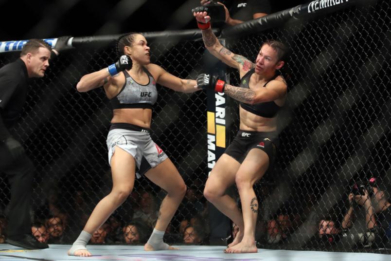 Amanda Nunes of Brazil punches Cris Cyborg of Brazil in their women's featherweight bout during the UFC 232 event inside The Forum on December 29, 2018 in Inglewood, California. (Photo by Christian Petersen/Zuffa LLC)