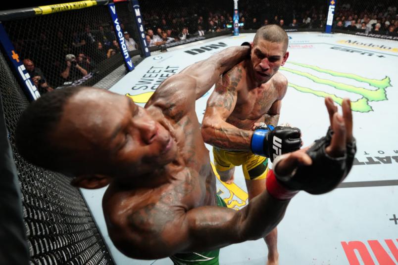Alex Pereira of Brazil punches Israel Adesanya of Nigeria in the UFC middleweight championship bout during the UFC 281 event at Madison Square Garden on November 12, 2022 in New York City. (Photo by Jeff Bottari/Zuffa LLC)