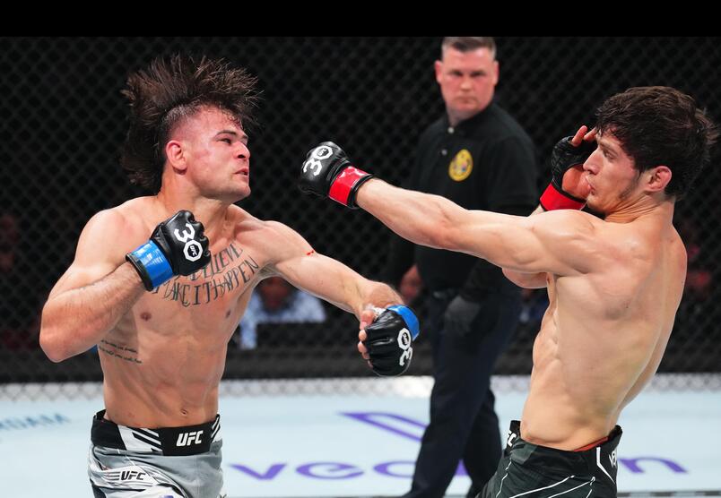 Movsar Evloev of Russia punches Diego Lopes of Brazil in a featherweight fight during the UFC 288 event at Prudential Center on May 06, 2023 in Newark, New Jersey. (Photo by Chris Unger/Zuffa LLC)
