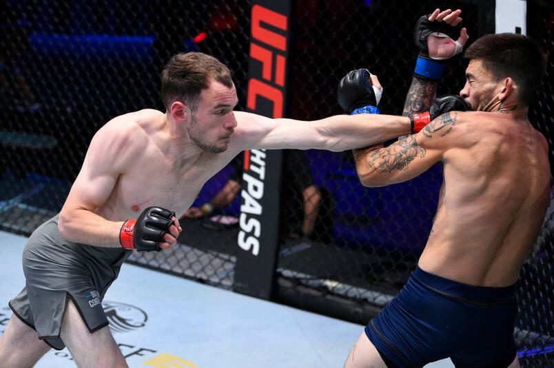 ros Medic of Serbia punches Mikey Gonzalez in their lightweight bout during Dana White's Contender Series season 4 week one at UFC APEX on August 04, 2020 in Las Vegas, Nevada. (Photo by Chris Unger/DWCS LLC/Zuffa LLC)