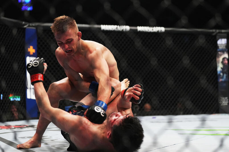 Cameron Saaiman of South Africa punches Mana Martinez in a bantamweight fight during the UFC 285 event at T-Mobile Arena on March 04, 2023 in Las Vegas, Nevada. (Photo by Cooper Neill/Zuffa LLC)