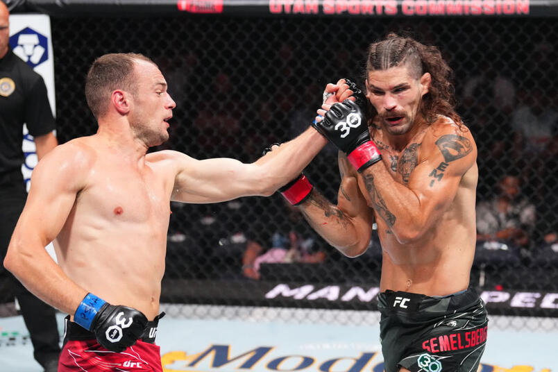 Uros Medic of Serbia punches Matthew Semelsberger in a welterweight fight during the UFC 291 event at Delta Center on July 29, 2023 in Salt Lake City, Utah. (Photo by Josh Hedges/Zuffa LLC)