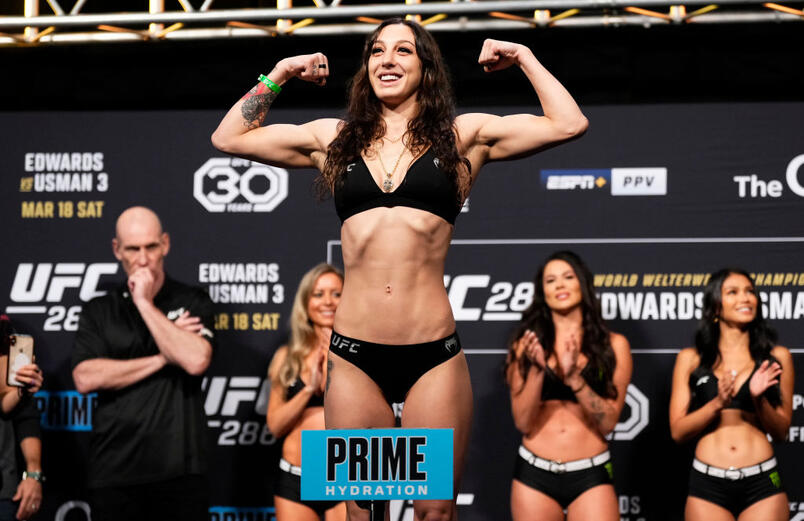 Juliana Miller poses on the scale during the UFC 286 ceremonial weigh-in at The O2 Arena on March 17, 2023 in London, England. (Photo by Jeff Bottari/Zuffa LLC)