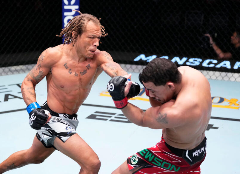 Marcus McGhee punches Journey Newsome in a bantamweight fight during the UFC Fight Night event at UFC APEX on April 29, 2023 in Las Vegas, Nevada. (Photo by Jeff Bottari/Zuffa LLC)
