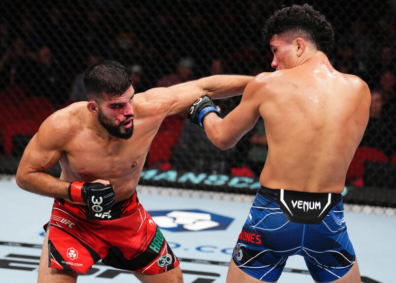 Nasrat Haqparast of Germany punches Landon Quinones in a lightweight fight during the UFC 293 event at Qudos Bank Arena on September 10, 2023 in Sydney, Australia. (Photo by Chris Unger/Zuffa LLC)