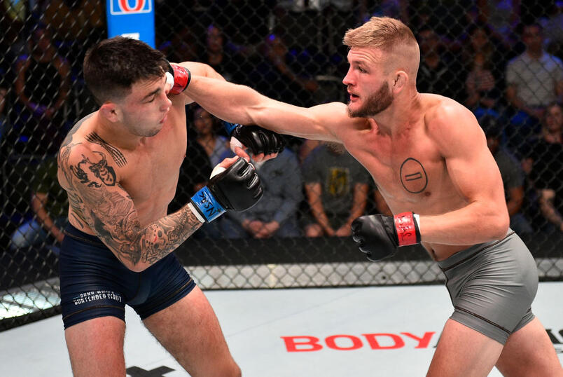 Jonathan Pearce punches Jacob Rosales in their lightweight bout during Dana White's Contender Series at the UFC Apex on July 9, 2019 in Las Vegas, Nevada. (Photo by Chris Unger/DWCS LLC)