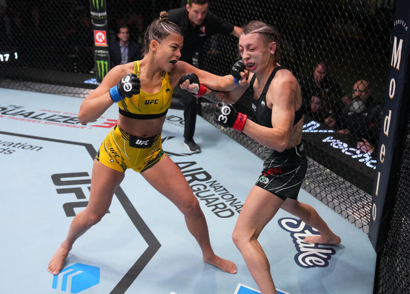  Luana Santos of Brazil punches Juliana Miller in a flyweight fight during the UFC Fight Night event at UFC APEX on August 12, 2023 in Las Vegas, Nevada. (Photo by Al Powers/Zuffa LLC)