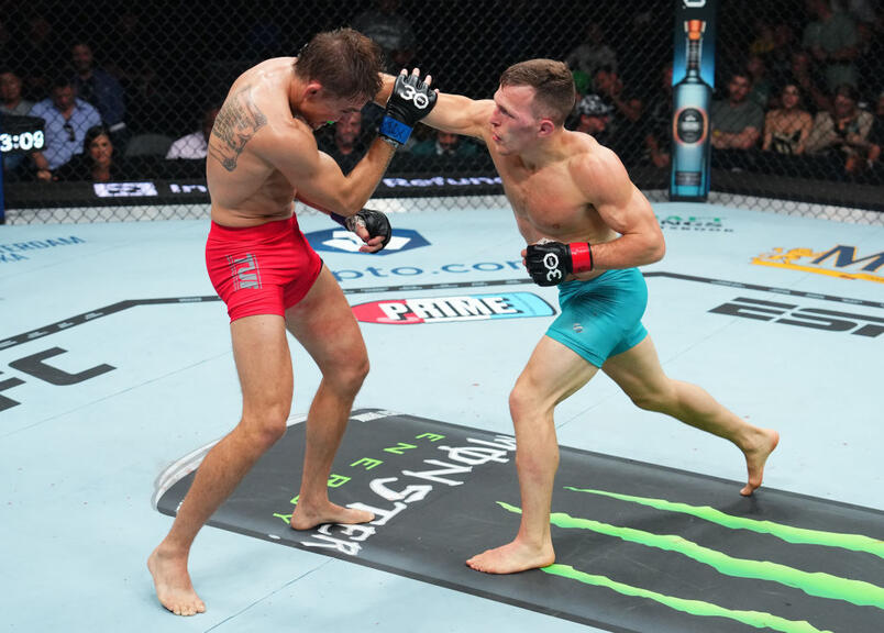 Cody Gibson punches Brad Katona of Canada in a bantamweight fight during the UFC 292 event at TD Garden on August 19, 2023 in Boston, Massachusetts. (Photo by Cooper Neill/Zuffa LLC)