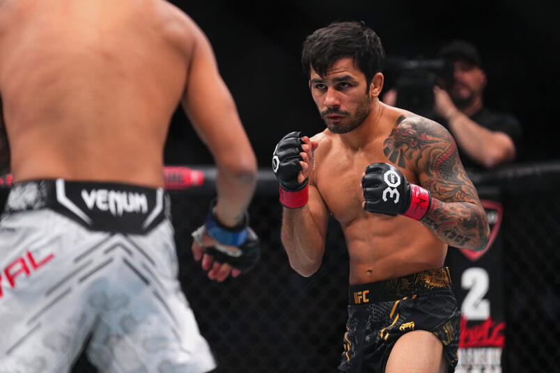Alexandre Pantoja of Brazil faces Brandon Royval in the UFC flyweight championship fight during the UFC 296 event at T-Mobile Arena on December 16, 2023 in Las Vegas, Nevada. (Photo by Cooper Neill/Zuffa LLC)