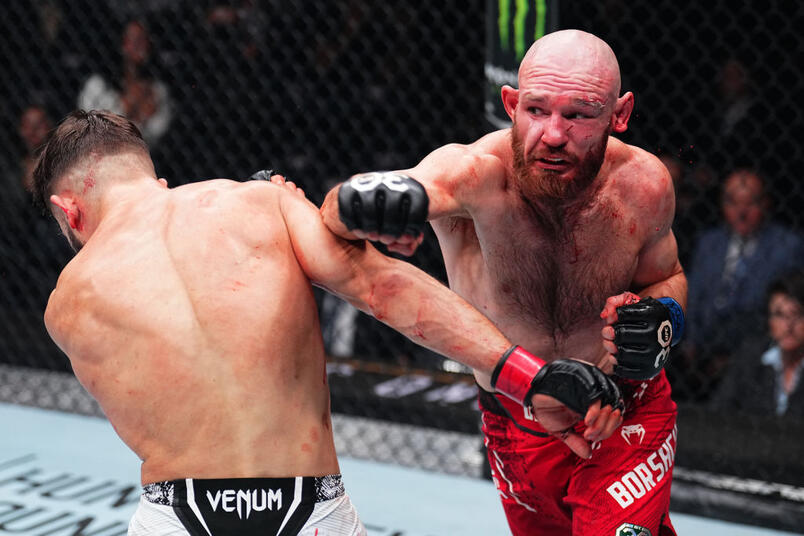 Viacheslav Borshchev of Russia punches Nazim Sadykhov of Russia in a lightweight fight during the UFC 295 event at Madison Square Garden on November 11, 2023 in New York City. (Photo by Chris Unger/Zuffa LLC)