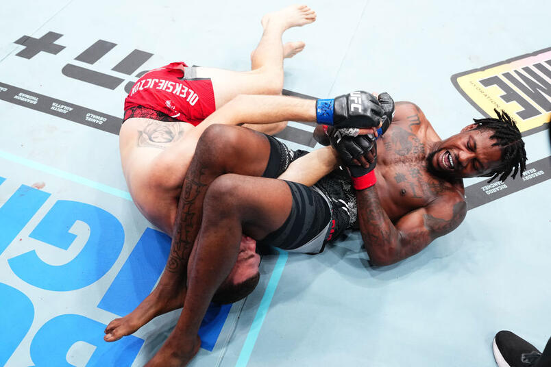 Kevin Holland secures an arm bar submission against Michal Oleksiejczuk of Poland in a middleweight fight during the UFC 302 event at Prudential Center on June 01, 2024 in Newark, New Jersey. (Photo by Jeff Bottari/Zuffa LLC via Getty Images)