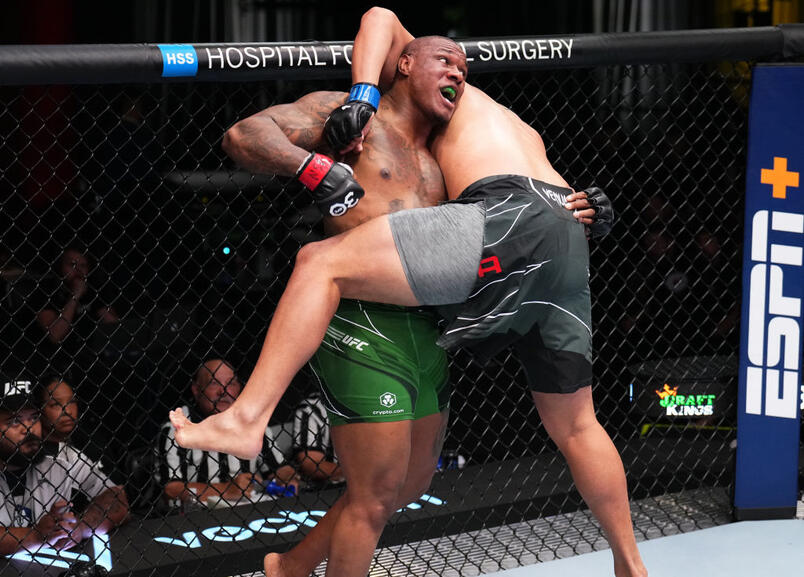 Mohammed Usman of Nigeria attempts to take down Junior Tafa of Australia in a heavyweight fight during the UFC Fight Night event at UFC APEX on April 22, 2023 in Las Vegas, Nevada. (Photo by Chris Unger/Zuffa LLC)