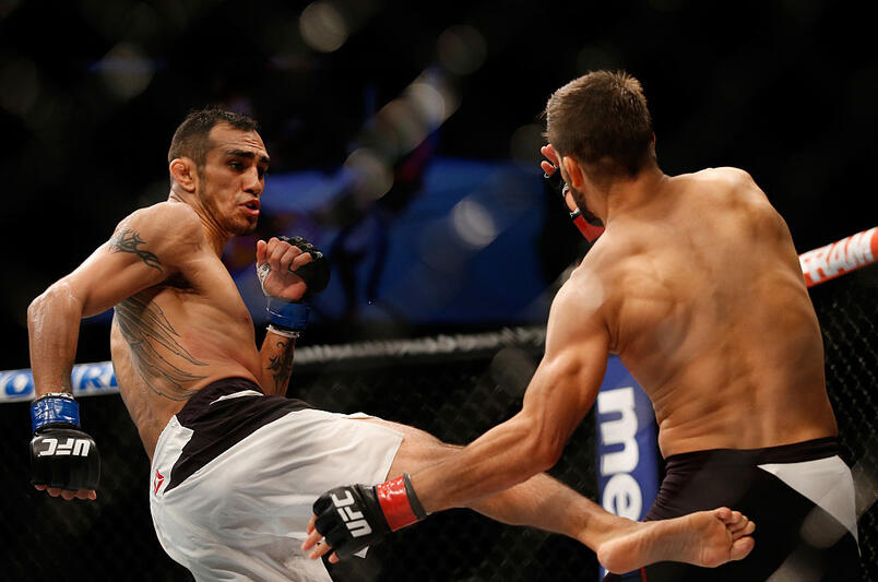 Tony Ferguson kicks Josh Thomson in their lightweight bout during the UFC event at the Valley View Casino Center on July 15, 2015 in San Diego, California. (Photo by Todd Warshaw/Zuffa LLC)