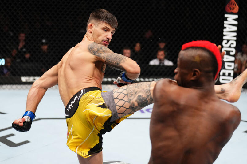 Joel Alvarez of Spain kicks Marc Diakiese of The Democratic Republic of Congo in their lightweight fight during the UFC Fight Night at The O2 Arena on July 22, 2023 in London, England. (Photo by Chris Unger/Zuffa LLC)