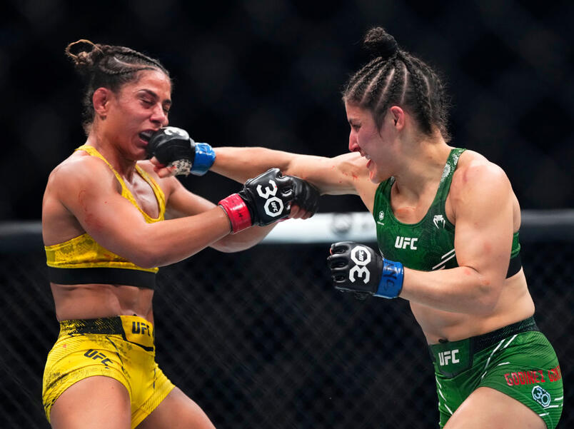 Loopy Godinez of Mexico punches Tabatha Ricci of Brazil in a strawweight fight during the UFC 295 event at Madison Square Garden on November 11, 2023 in New York City. (Photo by Jeff Bottari/Zuffa LLC)
