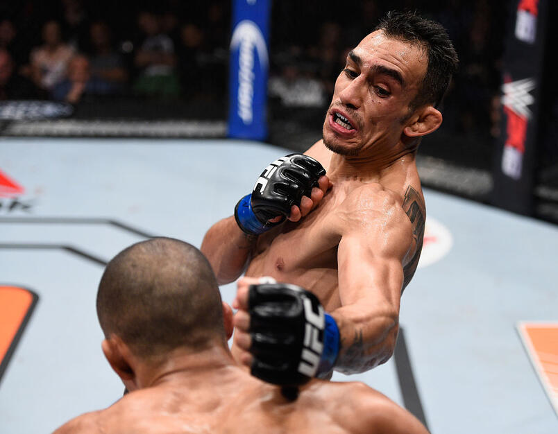 Tony Ferguson (top) punches Edson Barboza in their lightweight bout during the TUF Finale event inside The Chelsea at The Cosmopolitan of Las Vegas on December 11, 2015 in Las Vegas, Nevada. (Photo by Jeff Bottari/Zuffa LLC)
