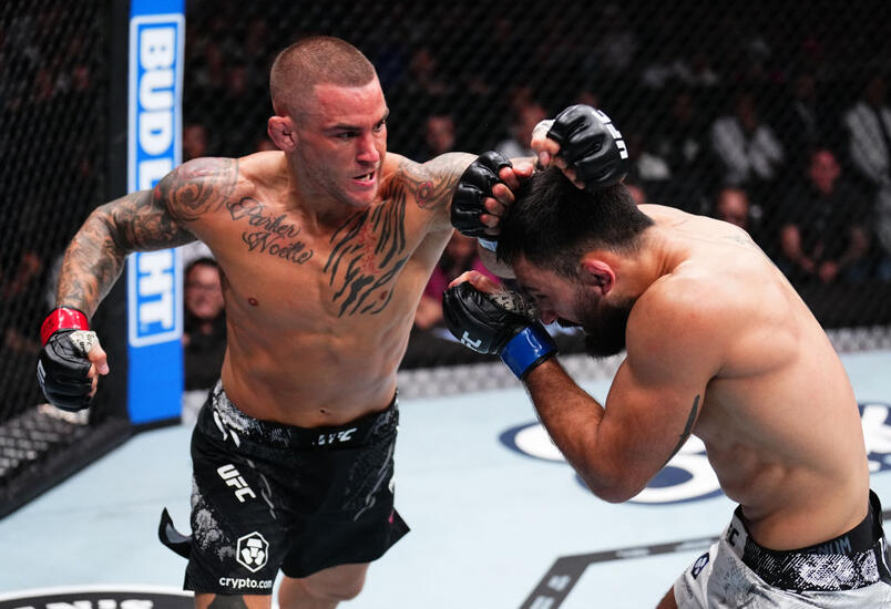 Dustin Poirier punches Benoit Saint Denis of France in a lightweight fight during the UFC 299 event at Kaseya Center on March 09, 2024 in Miami, Florida. (Photo by Chris Unger/Zuffa LLC)