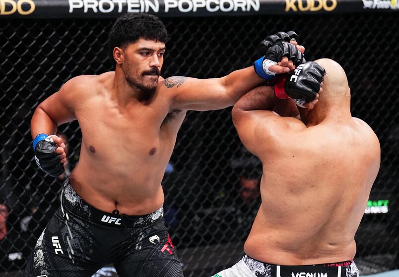 Junior Tafa punches Marcos Rogerio de Lima in a heavyweight fight during the UFC 298 event at Honda Center on February 17, 2024 in Anaheim, California. (Photo by Chris Unger/Zuffa LLC)