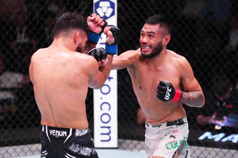 Josh Culibao punches Danny Silva in their featherweight fight during the UFC Fight Night event at UFC APEX on March 16, 2024 in Las Vegas, Nevada. (Photo by Jeff Bottari/Zuffa LLC)