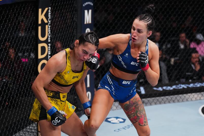 Casey O'Neill punches Ariane Lipski during the UFC 296 event at T-Mobile Arena on December 16, 2023 in Las Vegas, Nevada. (Photo by Jeff Bottari/Zuffa LLC)
