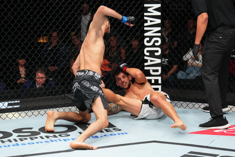 Fares Ziam of France punches Claudio Puelles of Peru in a lightweight fight during the UFC Fight Night event at Arena CDMX on February 24, 2024 in Mexico City, Mexico. (Photo by Josh Hedges/Zuffa LLC)
