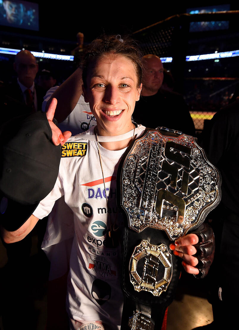 UFC women's strawweight champion Joanna Jedrzejczyk of Poland celebrates after defeating Jessica Penne of the United States in their women's strawweight championship bout during the UFC Fight Night event at the O2 World on June 20, 2015 in Berlin, Germany. 