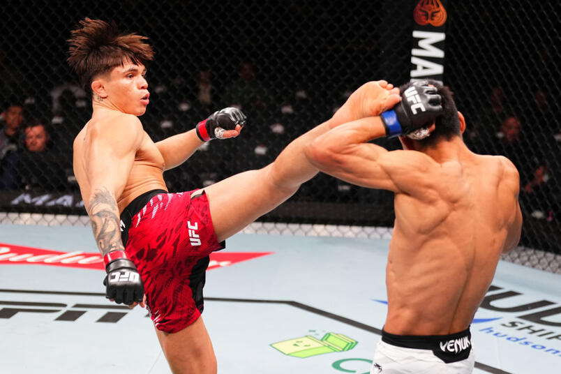 Lone'er Kavanagh of England kicks Jose Ochoa of Peru in their flyweight fight during the UFC Fight Night event at Galaxy Arena on November 23, 2024 in Macau, China. (Photo by Jeff Bottari/Zuffa LLC)