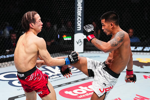 Joshua Van of Myanmar kicks Rei Tsuruya of Japan in a flyweight fight during the UFC 313 event at T-Mobile Arena on March 08, 2025 in Las Vegas, Nevada. (Photo by Jeff Bottari/Zuffa LLC)