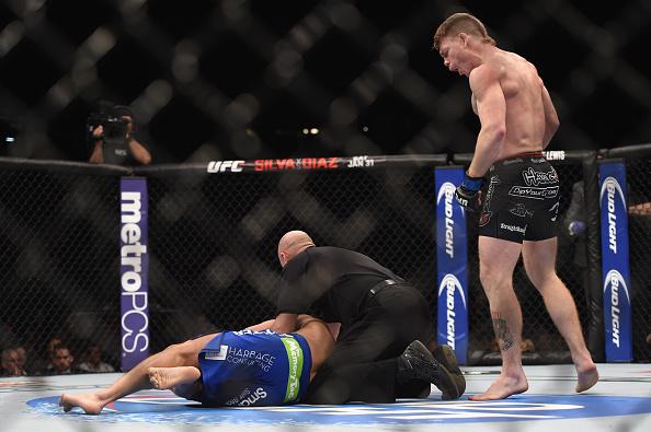 LAS VEGAS, NV - JANUARY 03: (Top) Paul Felder celebrates his win over Danny Castillo in their lightweight bout during the UFC 182 event at the MGM Grand Garden Arena on January 3, 2015 in Las Vegas, Nevada. (Photo by Jeff Bottari/Zuffa LLC/Zuffa LLC via