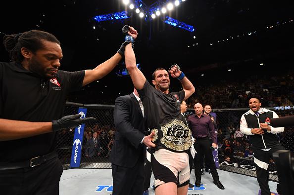LAS VEGAS, NV - DECEMBER 12: Luke Rockhold reacts to his victory over Chris Weidman in their UFC middleweight championship bout during the UFC 194 event inside MGM Grand Garden Arena on December 12, 2015 in Las Vegas, Nevada. (Photo by Josh Hedges/Zuffa
