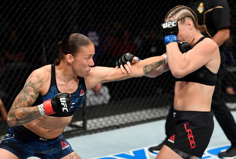 Germaine de Randamie of the Netherlands punches Aspen Ladd in their women's bantamweight bout during the UFC Fight Night