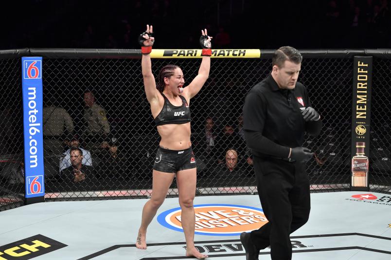 Jessica Eye celebrates the end of the round in her women's flyweight bout during the UFC 245.