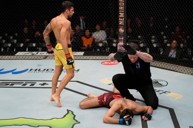 Alexandre Pantoja of Brazil celebrates after knocking out Matt Schnell in their flyweight fight during the UFC Fight Night