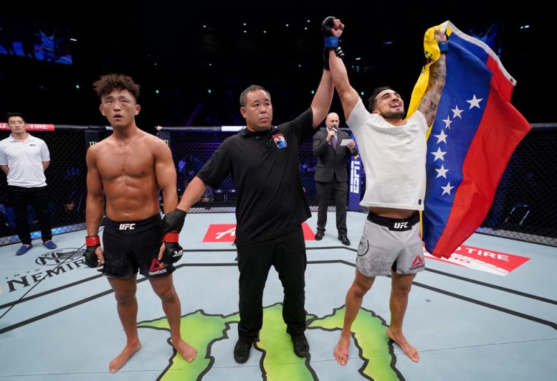 Omar Morales of Venezuela celebrates after his unanimous-decision victory over Dong Hyun Ma of South Korea in their lightweight fight during the UFC Fight Night