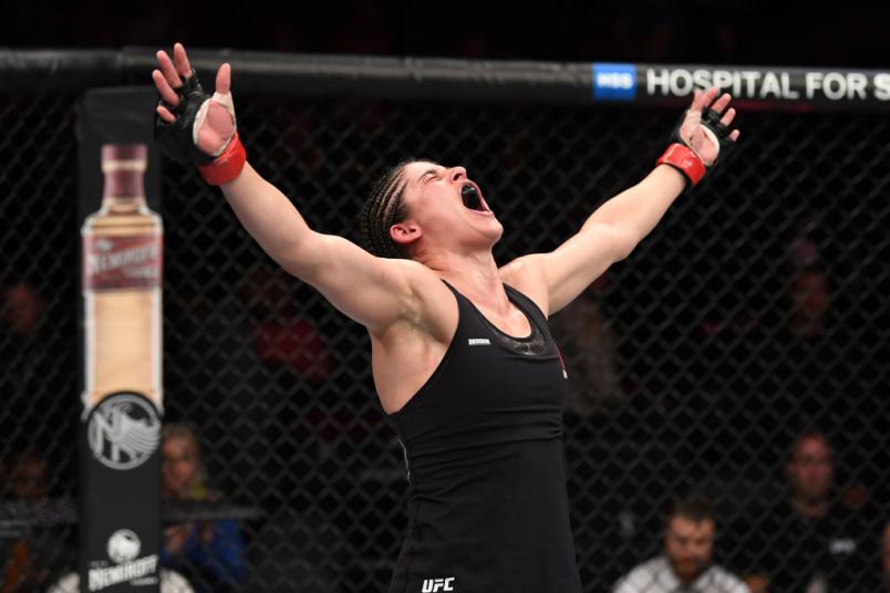 Julia Avila reacts after the conclusion of her bout against Pannie Kianzad of Sweden in their bantamweight fight during the UFC 239