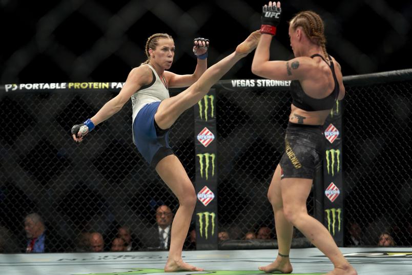 Katlyn Chookagian kicks Valentina Shevchenko of Kyrgyzstan in their women's flyweight championship bout during the UFC 247