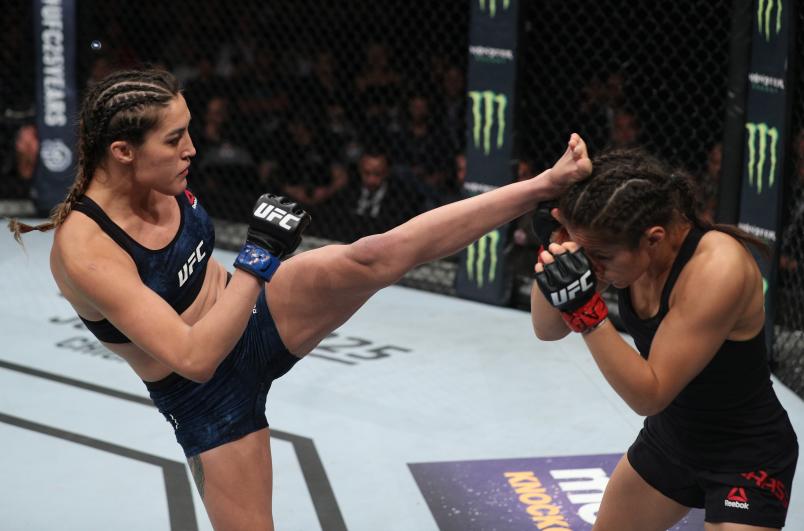 Tatiana Suarez kicks Alexa Grasso of Mexico in their women's strawweight bout during the UFC Fight Night