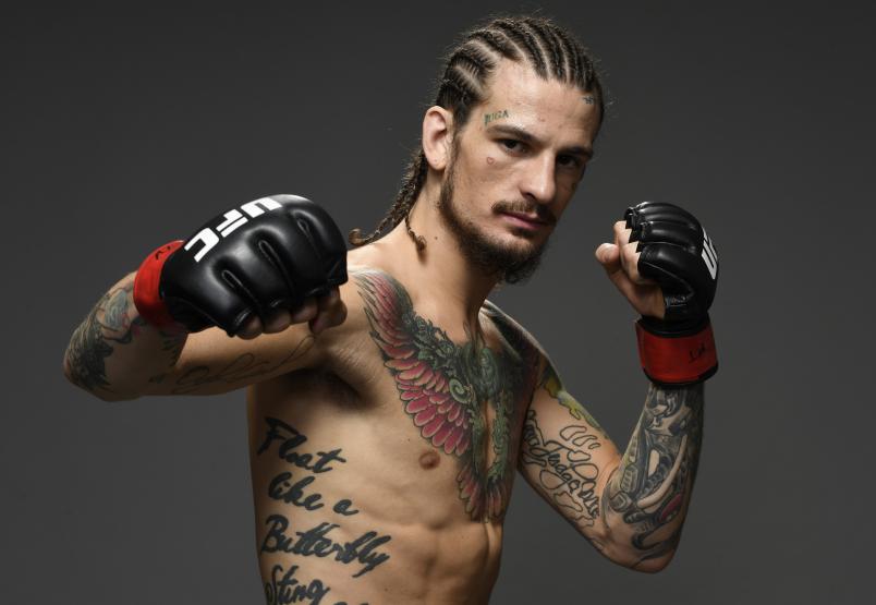 Sean O'Malley poses for a portrait backstage after his victory during the UFC 248