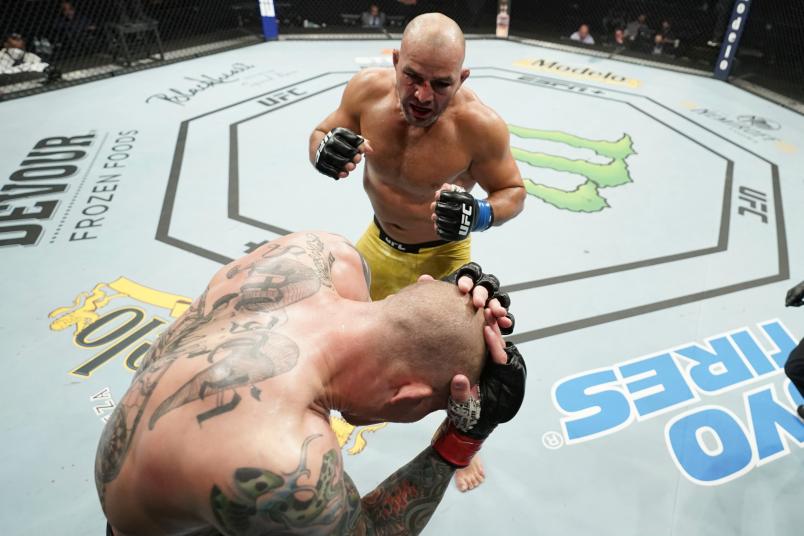 Glover Teixeira of Brazil (top) fights Anthony Smith in their light heavyweight bout during the UFC Fight Night