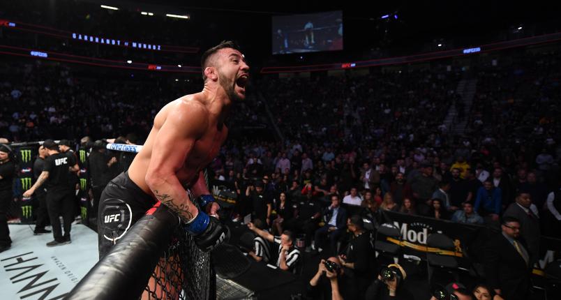 Pedro Munhoz of Brazil celebrates his victory over Cody Garbrandt in their bantamweight bout during the UFC 235