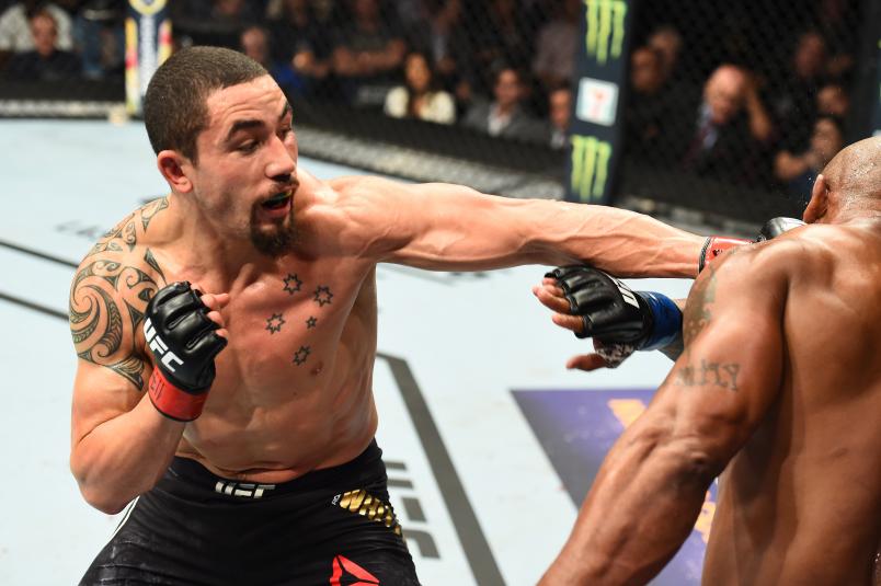 CHICAGO, ILLINOIS - JUNE 09: (L-R) Robert Whittaker of New Zealand punches Yoel Romero of Cuba in their middleweight fight