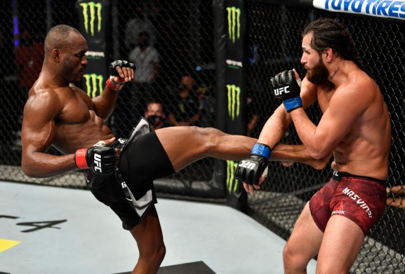 ABU DHABI, UNITED ARAB EMIRATES - JULY 12: (L-R) Kamaru Usman of Nigeria kicks Jorge Masvidal in their UFC welterweight championship fight during the UFC 251
